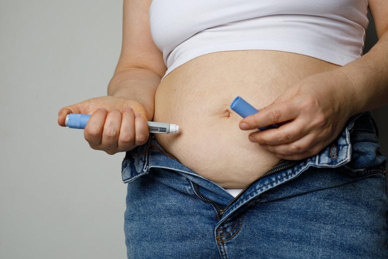 Woman injecting Semaglutide Ozempic Stomach